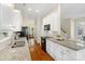 Modern kitchen with granite countertops, white cabinets, and stainless steel appliances at 6165 Caseys Side Way, Fort Mill, SC 29708