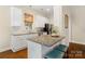 Bright kitchen featuring granite counters, a breakfast bar, and modern appliances at 6165 Caseys Side Way, Fort Mill, SC 29708