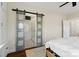 Spacious main bedroom with ensuite bathroom access via sliding barn door at 6165 Caseys Side Way, Fort Mill, SC 29708