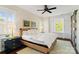 Bright main bedroom featuring a wicker bedframe, built-in storage, and neutral decor at 6165 Caseys Side Way, Fort Mill, SC 29708