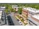 Street view captures brick building architecture with outdoor dining in a neighborhood with lush green trees at 6165 Caseys Side Way, Fort Mill, SC 29708