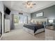 Cozy bedroom with tray ceiling, plush carpet, and an abundance of natural light at 621 Summey Farm Dr, Dallas, NC 28034