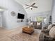 Cozy living room with vaulted ceiling, large TV, modern furniture, and bright natural lighting at 621 Summey Farm Dr, Dallas, NC 28034