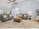 Spacious living room featuring vaulted ceiling, modern sofas, stylish rug, and ample natural light at 621 Summey Farm Dr, Dallas, NC 28034
