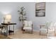 Comfortable sitting area showcasing stylish chairs, a modern lamp, and decorative wall art at 621 Summey Farm Dr, Dallas, NC 28034