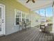 Inviting screened porch with seating area and view of the well-maintained backyard at 621 Summey Farm Dr, Dallas, NC 28034