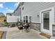 Cozy backyard patio with outdoor seating, garden decor, and privacy fence at 6563 Kinder Ln, Lancaster, SC 29720