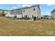 Large backyard featuring a comfortable patio and well-kept lawn, offering an ideal space for outdoor enjoyment at 6563 Kinder Ln, Lancaster, SC 29720