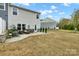 Expansive backyard with a cozy patio and well-maintained lawn, perfect for outdoor gatherings and relaxation at 6563 Kinder Ln, Lancaster, SC 29720