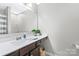 Bathroom featuring a large countertop, a mirror, and a sink with neutral walls at 6563 Kinder Ln, Lancaster, SC 29720