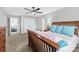 Inviting bedroom featuring a wood bed frame, ceiling fan, and soft, neutral decor for a serene retreat at 6563 Kinder Ln, Lancaster, SC 29720