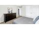Bedroom featuring a dresser, large bed, with an open doorway to an en suite bathroom at 6563 Kinder Ln, Lancaster, SC 29720