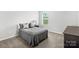 Neutral bedroom with carpet, large bed, and natural light from a window at 6563 Kinder Ln, Lancaster, SC 29720