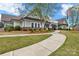 Attractive clubhouse featuring well-maintained landscaping and a charming walkway, enhancing the community's appeal at 6563 Kinder Ln, Lancaster, SC 29720