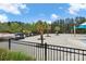 Large community pool with palm trees, lounge seating and playground equipment for neighborhood fun at 6563 Kinder Ln, Lancaster, SC 29720