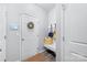 Inviting entryway with a bench, coat hooks, decorative mirror, and wood flooring at 6563 Kinder Ln, Lancaster, SC 29720