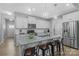 Bright kitchen featuring a large center island, modern appliances, and stylish pendant lighting at 6563 Kinder Ln, Lancaster, SC 29720