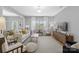 Spacious living room features neutral colors, stylish furnishings, and large windows for natural light at 6563 Kinder Ln, Lancaster, SC 29720