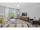Bright living room with modern decor, large window, and stylish furniture perfect for relaxing and entertaining at 6563 Kinder Ln, Lancaster, SC 29720