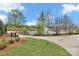 Scenic view of the pond with fountain and walking path with bench at 6563 Kinder Ln, Lancaster, SC 29720