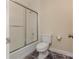 Cozy bathroom featuring tile flooring, a shower with sliding door, and a toilet at 6801 Dumbarton Dr, Charlotte, NC 28210