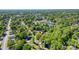 Aerial view of neighborhood with surrounding trees on a clear day at 702 Hazel Ave, Kannapolis, NC 28083