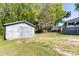 View of backyard with storage shed and greenery on a sunny day at 702 Hazel Ave, Kannapolis, NC 28083