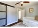 Bedroom with hardwood floors and barn-style closet doors at 702 Hazel Ave, Kannapolis, NC 28083