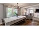 Bright dining area with hardwood floors, chandelier, and views of the living room at 702 Hazel Ave, Kannapolis, NC 28083