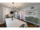 Spacious dining area with an open layout and an antique sideboard at 702 Hazel Ave, Kannapolis, NC 28083