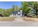 Charming single-story home with gray facade and manicured front yard at 702 Hazel Ave, Kannapolis, NC 28083