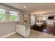 Open-concept kitchen with an island, granite countertops, and seamless open layout at 702 Hazel Ave, Kannapolis, NC 28083