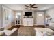 Inviting living room with a decorative fireplace, tv, and hardwood floors at 702 Hazel Ave, Kannapolis, NC 28083