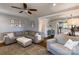 Inviting living room featuring hardwood floors, grey sectional, and open layout at 702 Hazel Ave, Kannapolis, NC 28083