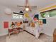 Playful bedroom featuring colorful decor, a cozy bed, and plenty of natural light at 7048 Delta Lake Dr, Charlotte, NC 28215
