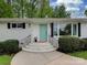 Charming exterior with a freshly painted brick and a welcoming front door at 7048 Delta Lake Dr, Charlotte, NC 28215