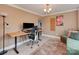 Bright office space with a desk, modern lighting and hardwood floors at 7048 Delta Lake Dr, Charlotte, NC 28215