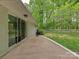 Spacious patio surrounded by green foliage, providing a peaceful outdoor setting at 7048 Delta Lake Dr, Charlotte, NC 28215