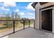 Private balcony offers outdoor living space with neighborhood views under a sunny sky at 710 Falling Oak Aly # 17, Huntersville, NC 28078
