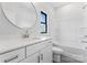 Clean bathroom showcasing a white vanity, toilet and tub with natural light at 710 Falling Oak Aly # 17, Huntersville, NC 28078