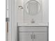 Bright bathroom featuring a round mirror, modern vanity, and brushed gold finishes at 710 Falling Oak Aly # 17, Huntersville, NC 28078