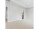 Neutral bedroom with tray ceiling and ensuite bathroom access at 710 Falling Oak Aly # 17, Huntersville, NC 28078