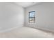 Bedroom with a large window and neutral carpet at 710 Falling Oak Aly # 17, Huntersville, NC 28078