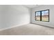 Light-filled bedroom with a large window showcasing the outdoor view at 710 Falling Oak Aly # 17, Huntersville, NC 28078