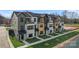 New townhome featuring modern architecture, black trim, and manicured landscaping at 710 Falling Oak Aly # 17, Huntersville, NC 28078