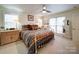 Bright bedroom featuring neutral walls, carpet flooring, and white metal bed frame at 7184 Seagrass Cir, Denver, NC 28037