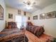 Bedroom featuring hardwood floors, and twin beds with metal frames and patterned bedding at 7184 Seagrass Cir, Denver, NC 28037