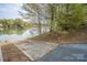 Private ramp leads to the serene lake, perfect for water activities and enjoying the waterfront lifestyle at 7184 Seagrass Cir, Denver, NC 28037
