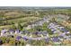 Wonderful aerial view of a beautiful neighborhood featuring manicured lawns and mature trees at 7186 Barleywood Dr, Locust, NC 28097