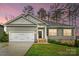 Charming single-Gathering home with an attached garage and a well-maintained lawn at 7186 Barleywood Dr, Locust, NC 28097
